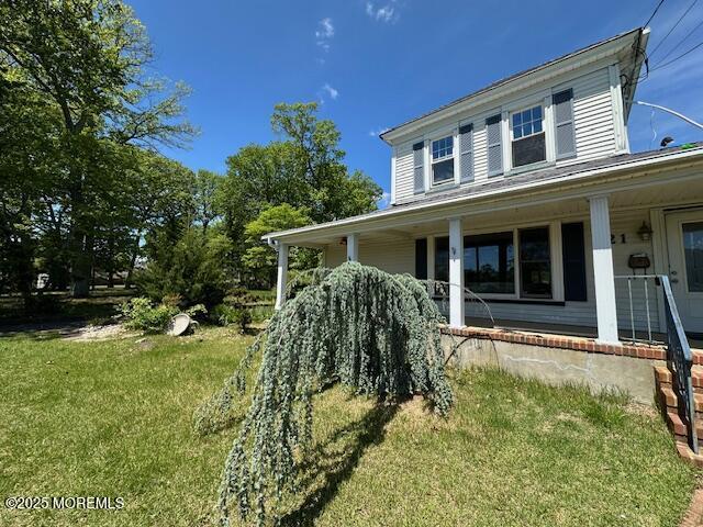 421 W Lincoln Ave, Oakhurst, NJ 07755 - view of side of home with a porch and a yard