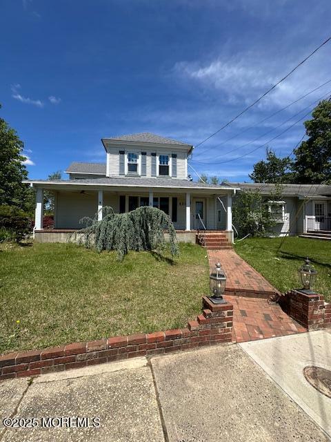 421 W Lincoln Ave, Oakhurst, NJ 07755 - country-style home with covered porch and a front yard
