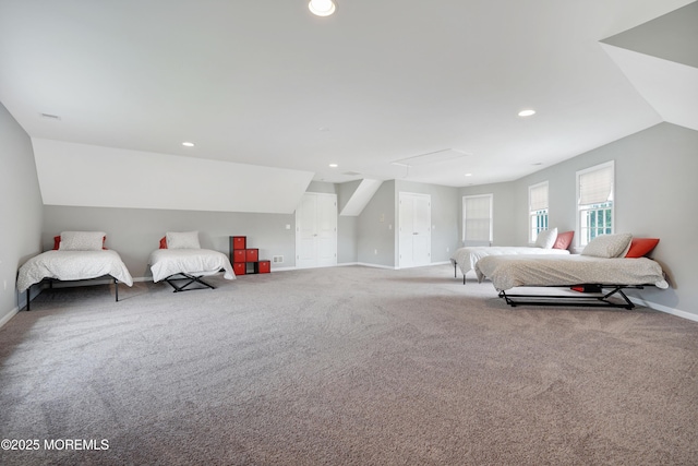 carpeted bedroom with lofted ceiling, baseboards, and recessed lighting