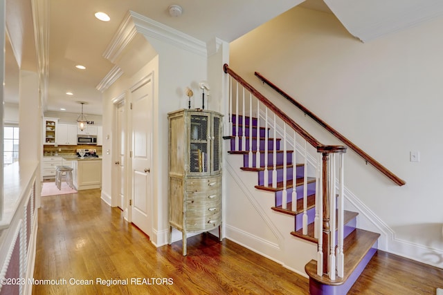 35 Embury Ave, Ocean Grove, NJ 07756 - stairs featuring crown molding, wood finished floors, recessed lighting, and baseboards