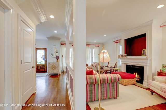 35 Embury Ave, Ocean Grove, NJ 07756 - living area featuring ornamental molding, wood finished floors, healthy amount of natural light, a lit fireplace, and recessed lighting