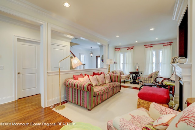 35 Embury Ave, Ocean Grove, NJ 07756 - living area featuring wood finished floors, crown molding, recessed lighting, baseboards, and a fireplace