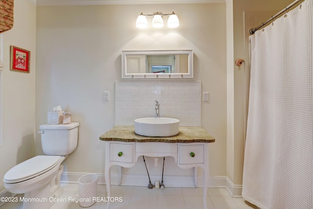 35 Embury Ave, Ocean Grove, NJ 07756 - bathroom with decorative backsplash, toilet, baseboards, and tile patterned flooring