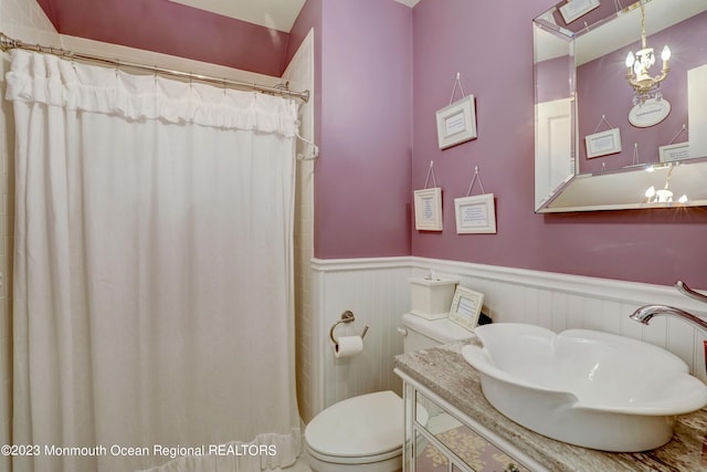 35 Embury Ave, Ocean Grove, NJ 07756 - bathroom with a wainscoted wall, toilet, vanity, and a shower with curtain
