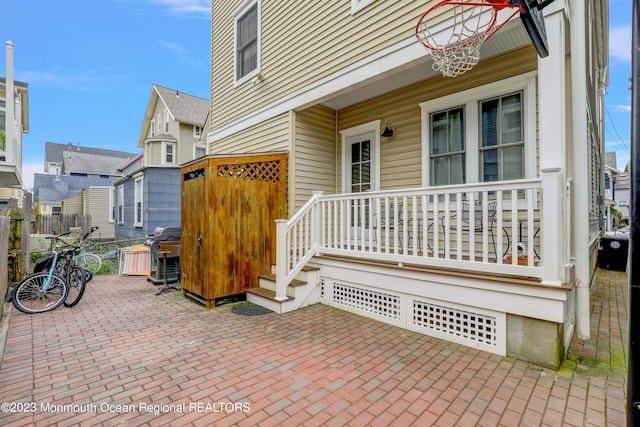35 Embury Ave, Ocean Grove, NJ 07756 - view of patio / terrace with covered porch, a grill, and fence