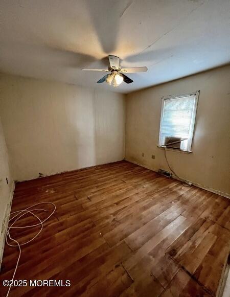 80 Seeley Ave, Keansburg, NJ 07734 - unfurnished room featuring wood finished floors and ceiling fan