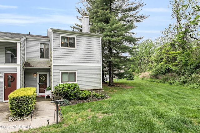11 Joyce Ct, Tinton Falls, NJ 07724 - view of front facade with a front lawn and a chimney
