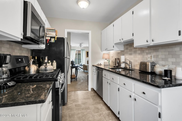 11 Joyce Ct, Tinton Falls, NJ 07724 - kitchen featuring appliances with stainless steel finishes, a sink, a ceiling fan, white cabinets, and decorative backsplash