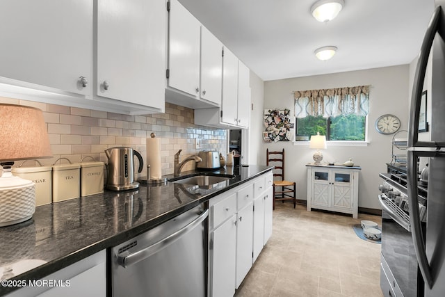 11 Joyce Ct, Tinton Falls, NJ 07724 - kitchen featuring dishwasher, a sink, decorative backsplash, and white cabinetry