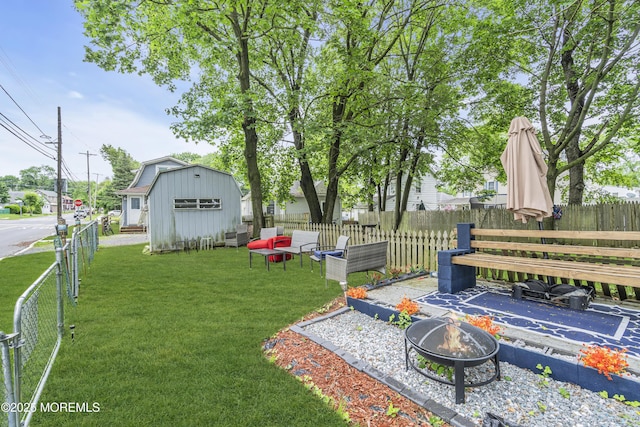 23 Vought Ave, Freehold, NJ 07728 - view of yard featuring an outdoor fire pit and an outbuilding