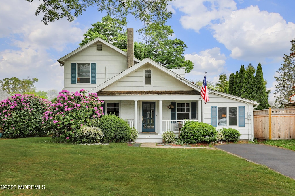 284 Osborne Ave, Bay Head, NJ 08742 - view of front facade featuring a porch and a chimney