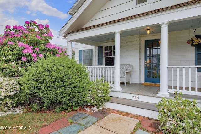 doorway to property with covered porch