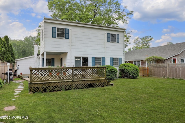 rear view of house featuring a deck