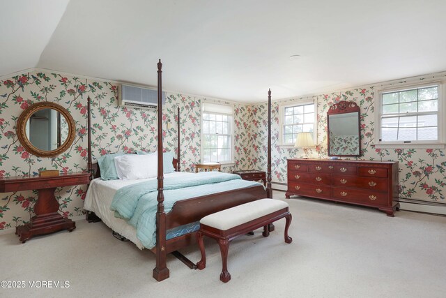 carpeted bedroom with wallpapered walls, an AC wall unit, baseboard heating, and vaulted ceiling