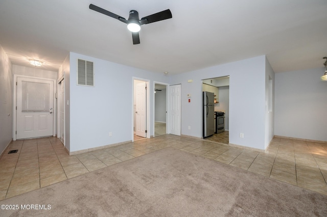 270 Main St Unit 6, Keansburg, NJ 07734 - unfurnished bedroom with tile patterned flooring, freestanding refrigerator, baseboards, and carpet flooring