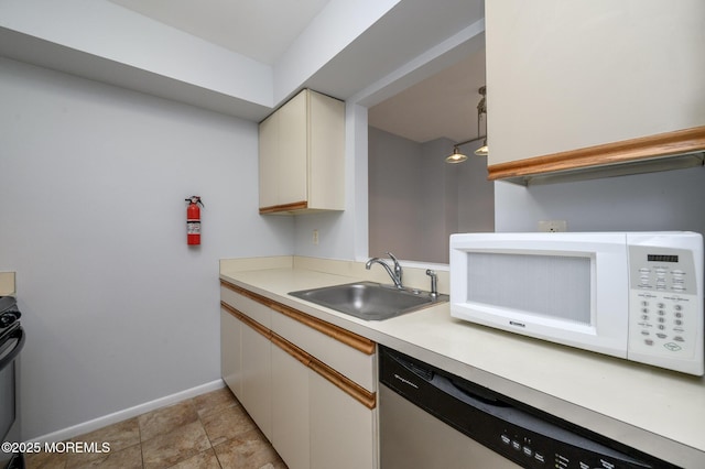 270 Main St Unit 6, Keansburg, NJ 07734 - kitchen featuring stainless steel dishwasher, white microwave, a sink, baseboards, and light countertops