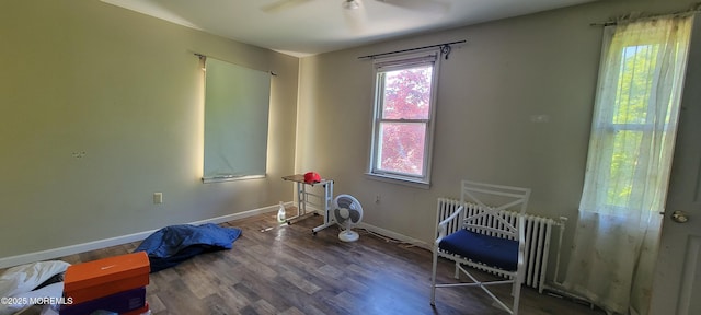399 Willow Ave, Long Branch, NJ 07740 - bedroom featuring radiator heating unit, wood finished floors, baseboards, and ceiling fan
