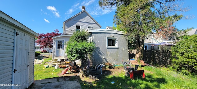 399 Willow Ave, Long Branch, NJ 07740 - rear view of house featuring fence and stucco siding