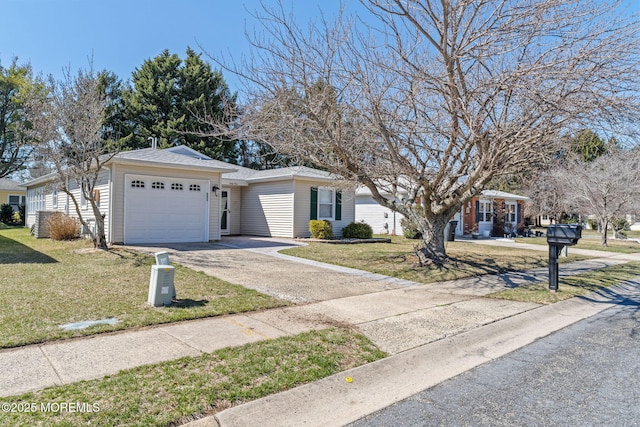 63 Lauren Ln N, Brick, NJ 08723 - single story home with asphalt driveway, an attached garage, and a front lawn