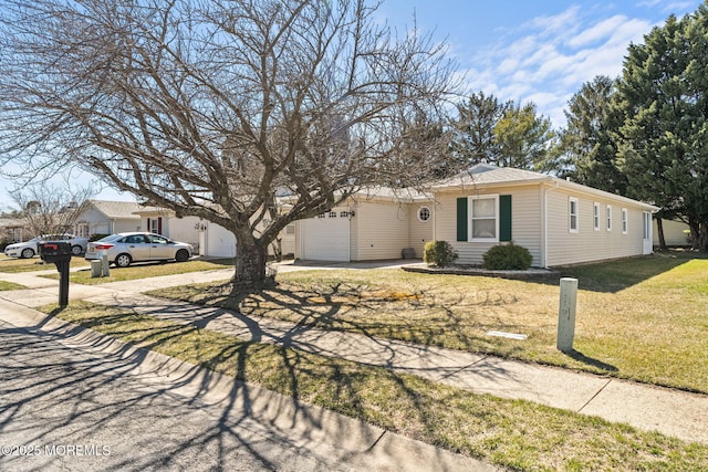 63 Lauren Ln N, Brick, NJ 08723 - view of front of house featuring concrete driveway, a garage, and a front yard