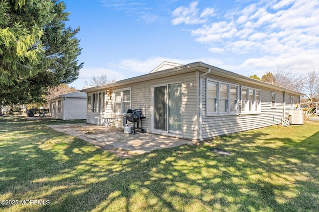 63 Lauren Ln N, Brick, NJ 08723 - back of house with a lawn and a patio