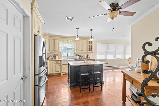 63 Lauren Ln N, Brick, NJ 08723 - kitchen featuring cream cabinetry, stainless steel fridge with ice dispenser, a sink, a kitchen island, and crown molding