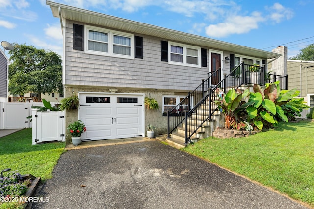 2118 Kenneth Rd, Point Pleasant, NJ 08742 - view of front of home featuring a garage, a gate, driveway, and stairs