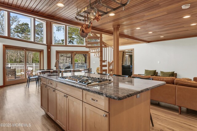 328 E Pleasant Grove Rd, Jackson, NJ 08527 - kitchen with wood ceiling, stainless steel gas cooktop, a sink, open floor plan, and a kitchen island with sink