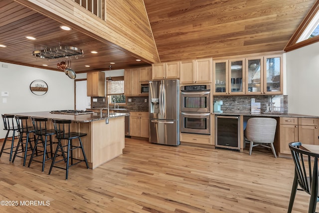 328 E Pleasant Grove Rd, Jackson, NJ 08527 - kitchen with wine cooler, appliances with stainless steel finishes, a breakfast bar, backsplash, and wooden ceiling