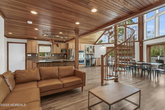 328 E Pleasant Grove Rd, Jackson, NJ 08527 - living area with wooden ceiling, healthy amount of natural light, stairs, light wood finished floors, and a towering ceiling
