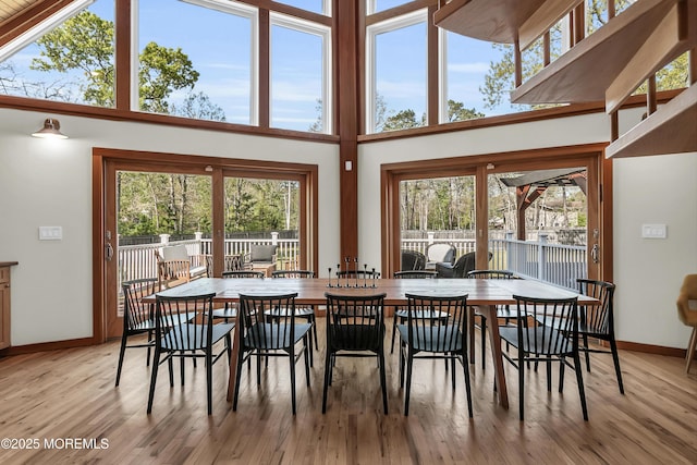 328 E Pleasant Grove Rd, Jackson, NJ 08527 - dining space with baseboards, light wood-type flooring, healthy amount of natural light, and a high ceiling