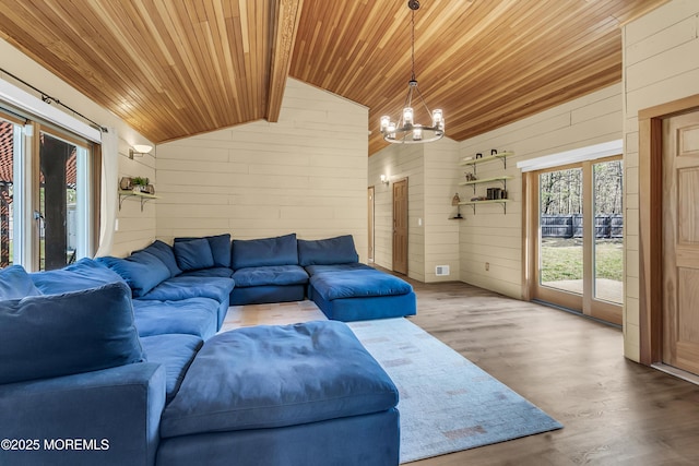 328 E Pleasant Grove Rd, Jackson, NJ 08527 - living area featuring wood ceiling, vaulted ceiling, a chandelier, wood walls, and wood finished floors