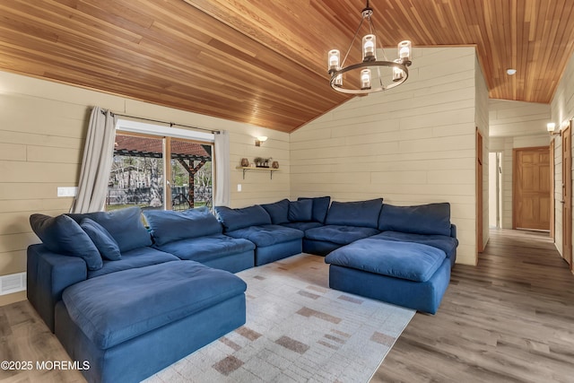 328 E Pleasant Grove Rd, Jackson, NJ 08527 - living room featuring wooden ceiling, vaulted ceiling, a chandelier, wood finished floors, and wooden walls