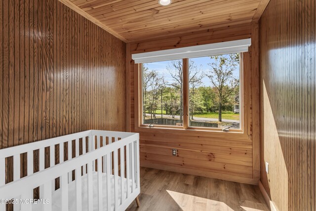 328 E Pleasant Grove Rd, Jackson, NJ 08527 - bedroom with wooden walls, wood finished floors, and wood ceiling