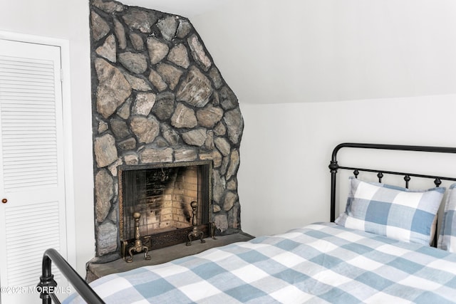 328 E Pleasant Grove Rd, Jackson, NJ 08527 - bedroom with vaulted ceiling and a stone fireplace
