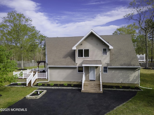 328 E Pleasant Grove Rd, Jackson, NJ 08527 - back of house with a shingled roof and a yard