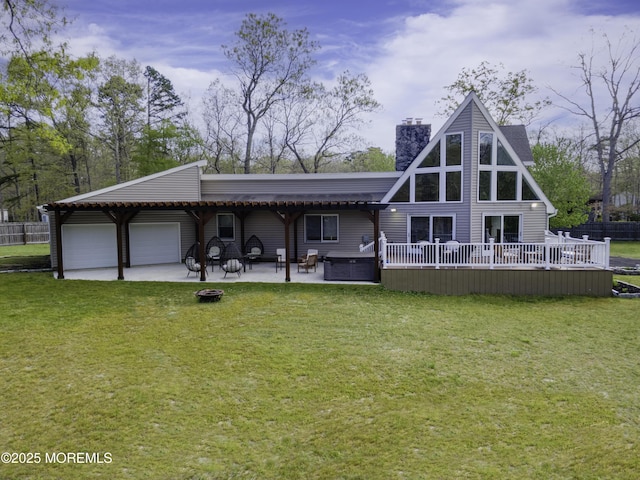 328 E Pleasant Grove Rd, Jackson, NJ 08527 - back of property featuring a chimney, an attached garage, a hot tub, a patio, and driveway