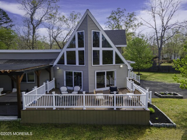 328 E Pleasant Grove Rd, Jackson, NJ 08527 - rear view of property with a wooden deck, a lawn, and roof with shingles
