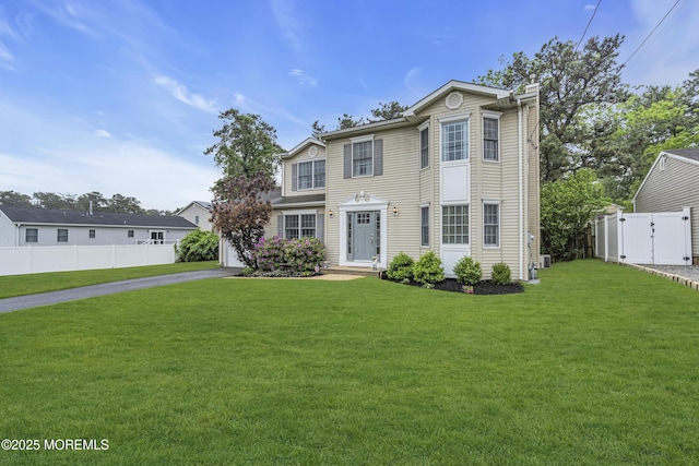 2124 3rd Ave, Toms River, NJ 08757 - view of front facade with driveway, a chimney, a garage, and a gate