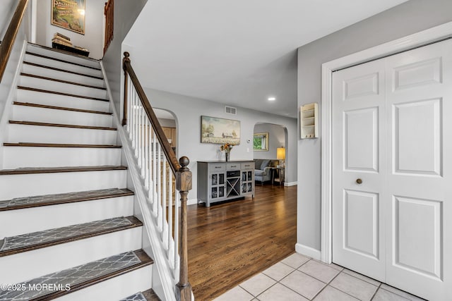2124 3rd Ave, Toms River, NJ 08757 - stairs featuring arched walkways, recessed lighting, tile patterned flooring, and baseboards