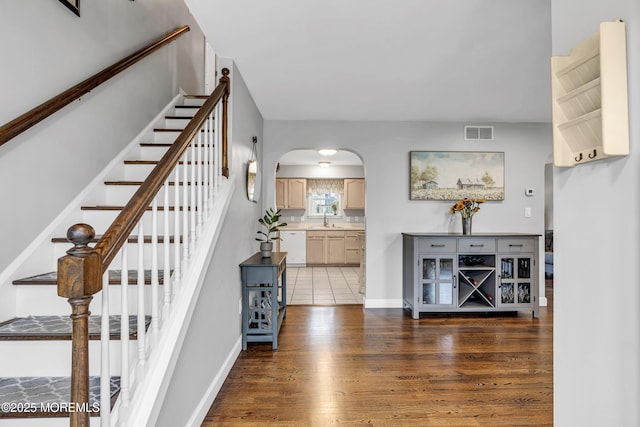 2124 3rd Ave, Toms River, NJ 08757 - entryway with arched walkways, wood finished floors, and stairway