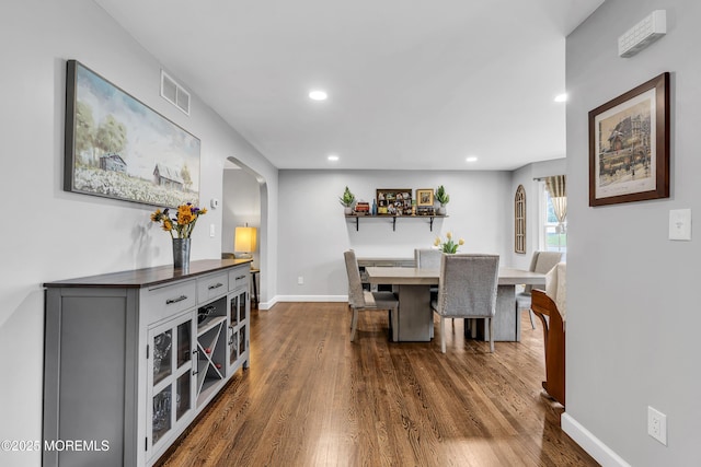2124 3rd Ave, Toms River, NJ 08757 - dining room with arched walkways, recessed lighting, dark wood-style flooring, and baseboards