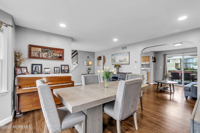 2124 3rd Ave, Toms River, NJ 08757 - dining space with arched walkways, stairway, dark wood finished floors, recessed lighting, and baseboards