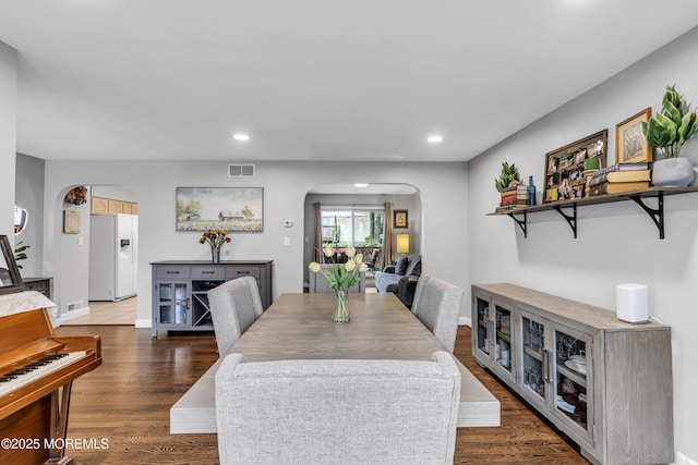2124 3rd Ave, Toms River, NJ 08757 - dining space with arched walkways, wood finished floors, recessed lighting, and baseboards