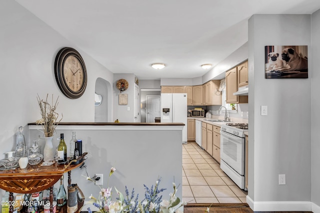 2124 3rd Ave, Toms River, NJ 08757 - kitchen featuring white appliances, light brown cabinetry, a sink, light tile patterned floors, and under cabinet range hood
