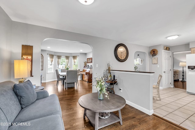 2124 3rd Ave, Toms River, NJ 08757 - living area with arched walkways, wood finished floors, and baseboards