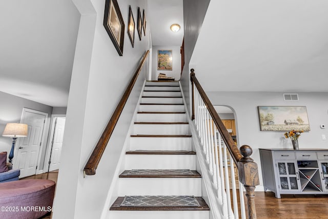 2124 3rd Ave, Toms River, NJ 08757 - staircase with arched walkways and wood finished floors