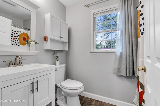2124 3rd Ave, Toms River, NJ 08757 - full bathroom featuring baseboards, toilet, vanity, and wood finished floors