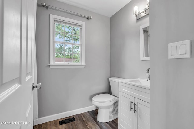 2124 3rd Ave, Toms River, NJ 08757 - half bathroom featuring toilet, baseboards, vanity, and wood finished floors