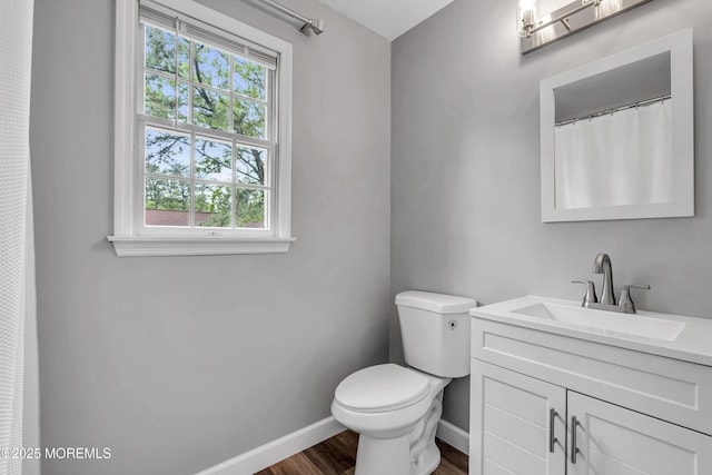 2124 3rd Ave, Toms River, NJ 08757 - full bathroom with toilet, vanity, baseboards, and wood finished floors
